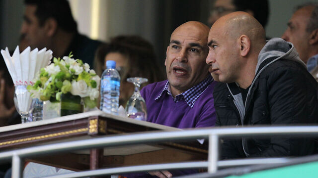 Former Egyptian footballers Hossam Hassan and Ibrahim Hassan attend the 2011 Asian Cup quarter-final football match between Australia and Iraq at Al-Sadd Stadium in the Qatari capital Doha on January 22, 2011. AFP PHOTO / KARIM JAAFAR