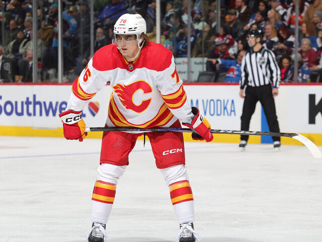 DENVER, COLORADO - NOVEMBER 25: Martin Pospisil #76 of the Calgary Flames awaits a face-off against the Colorado Avalanche at Ball Arena on November 25, 2023 in Denver, Colorado.