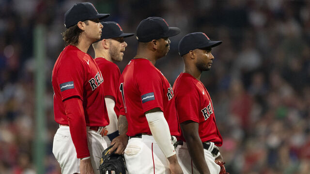 BOSTON, MA - AUGUST 25: Triston Casas #36 of the Boston Red Sox, Trevor Story #10 of the Boston Red Sox, Rafael Devers #11 of the Boston Red Sox, and Pablo Reyes #19 of the Boston Red Sox look on during a pitching change against the Los Angeles Dodgers on August 25, 2023 at Fenway Park in Boston, Massachusetts.