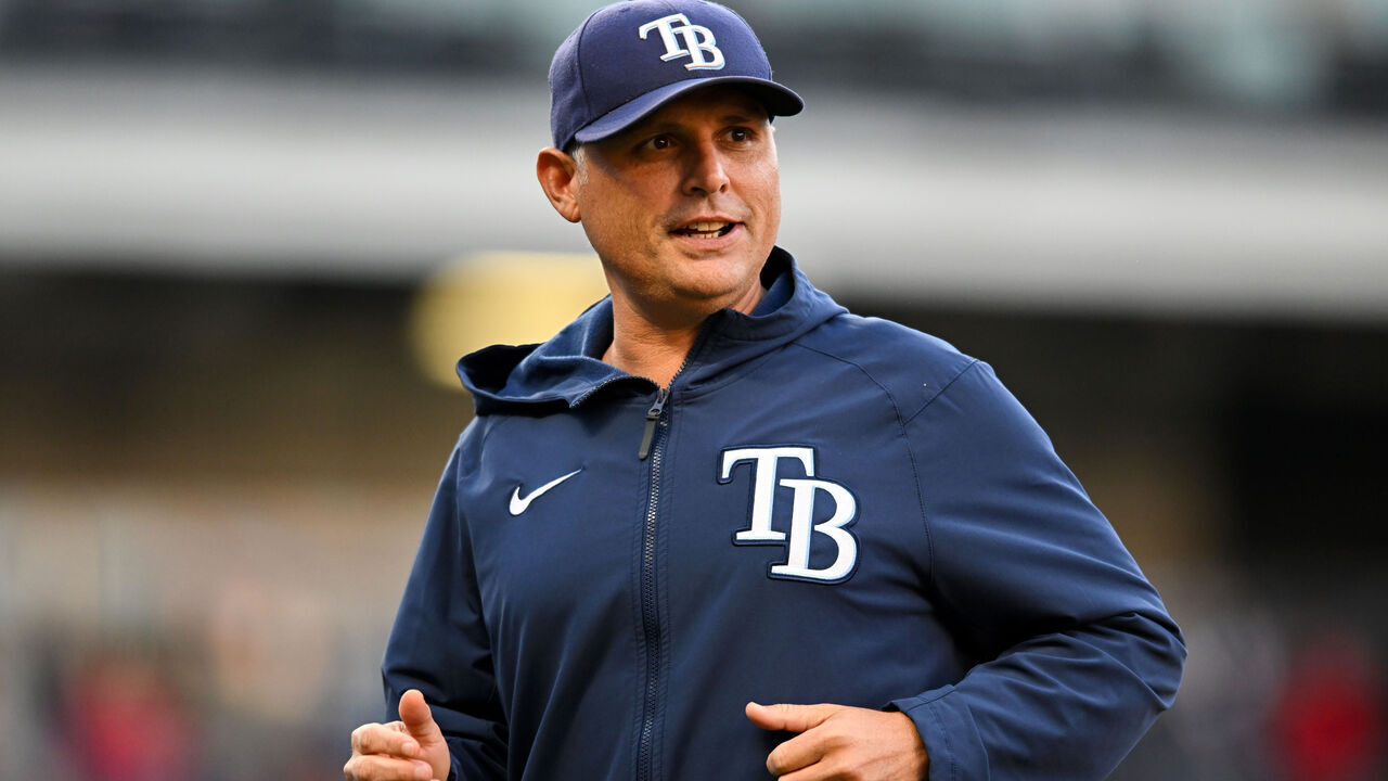 CLEVELAND, OH - SEPTEMBER 29: Manager Kevin Cash #16 of the Tampa Bay Rays runs off the field during the first inning against the Cleveland Guardians at Progressive Field on September 29, 2022 in Cleveland, Ohio.