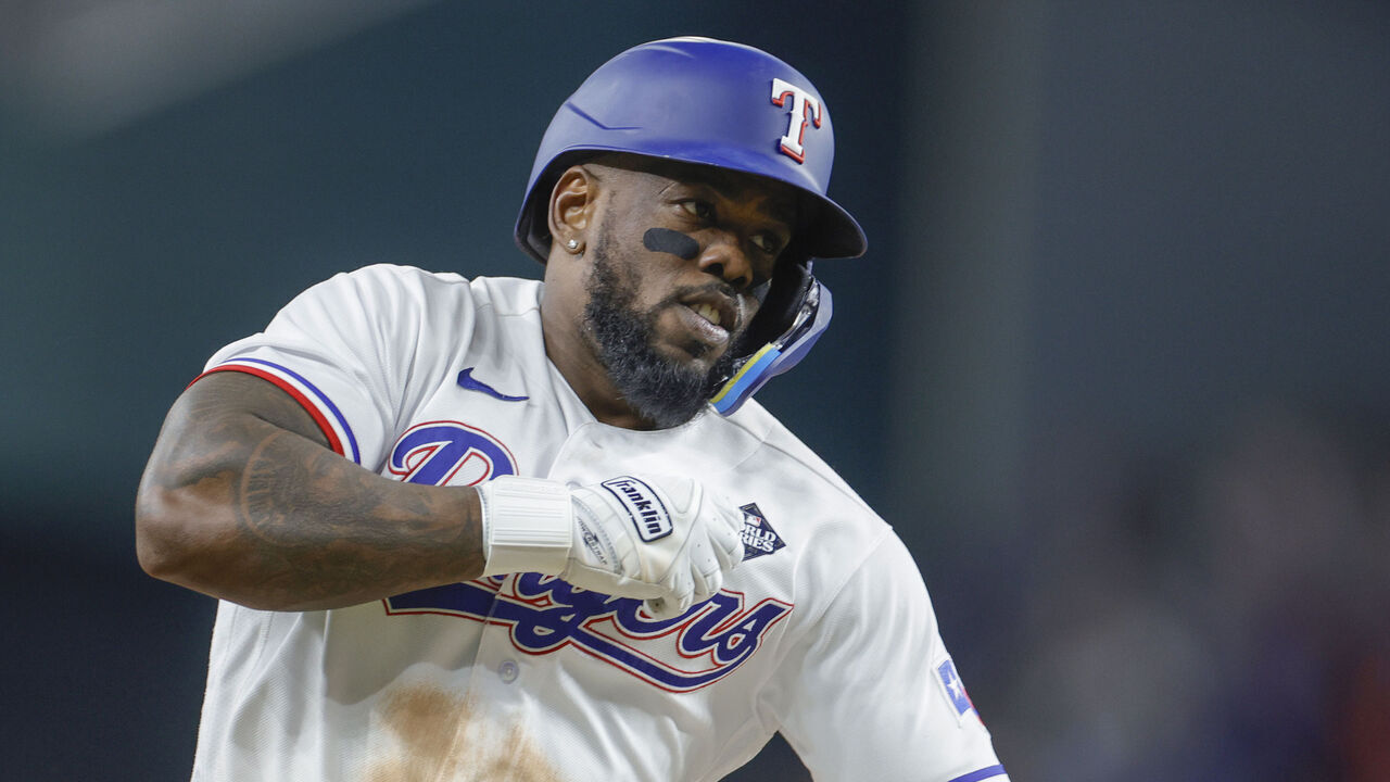 ARLINGTON, TEXAS - OCTOBER 27: Adolis García #53 of the Texas Rangers celebrates as he rounds the bases after hitting a home run in the 11th inning to beat the Arizona Diamondbacks 6-5 in Game One of the World Series at Globe Life Field on October 27, 2023 in Arlington, Texas.