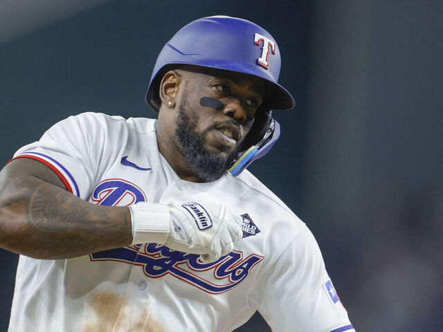 ARLINGTON, TEXAS - OCTOBER 27: Adolis García #53 of the Texas Rangers celebrates as he rounds the bases after hitting a home run in the 11th inning to beat the Arizona Diamondbacks 6-5 in Game One of the World Series at Globe Life Field on October 27, 2023 in Arlington, Texas.