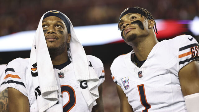 LANDOVER, MARYLAND - OCTOBER 05: DJ Moore #2 of the Chicago Bears and Justin Fields #1 of the Chicago Bears react as they look on prior to an NFL football game between the Washington Commanders and the Chicago Bears at FedExField on October 05, 2023 in Landover, Maryland.