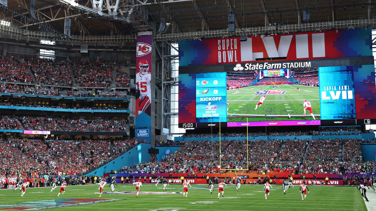 GLENDALE, ARIZONA - FEBRUARY 12: Harrison Butker #7 of the Kansas City Chiefs kicks the opening kickoff against the Philadelphia Eagles in the first quarter of in Super Bowl LVII at State Farm Stadium on February 12, 2023 in Glendale, Arizona.