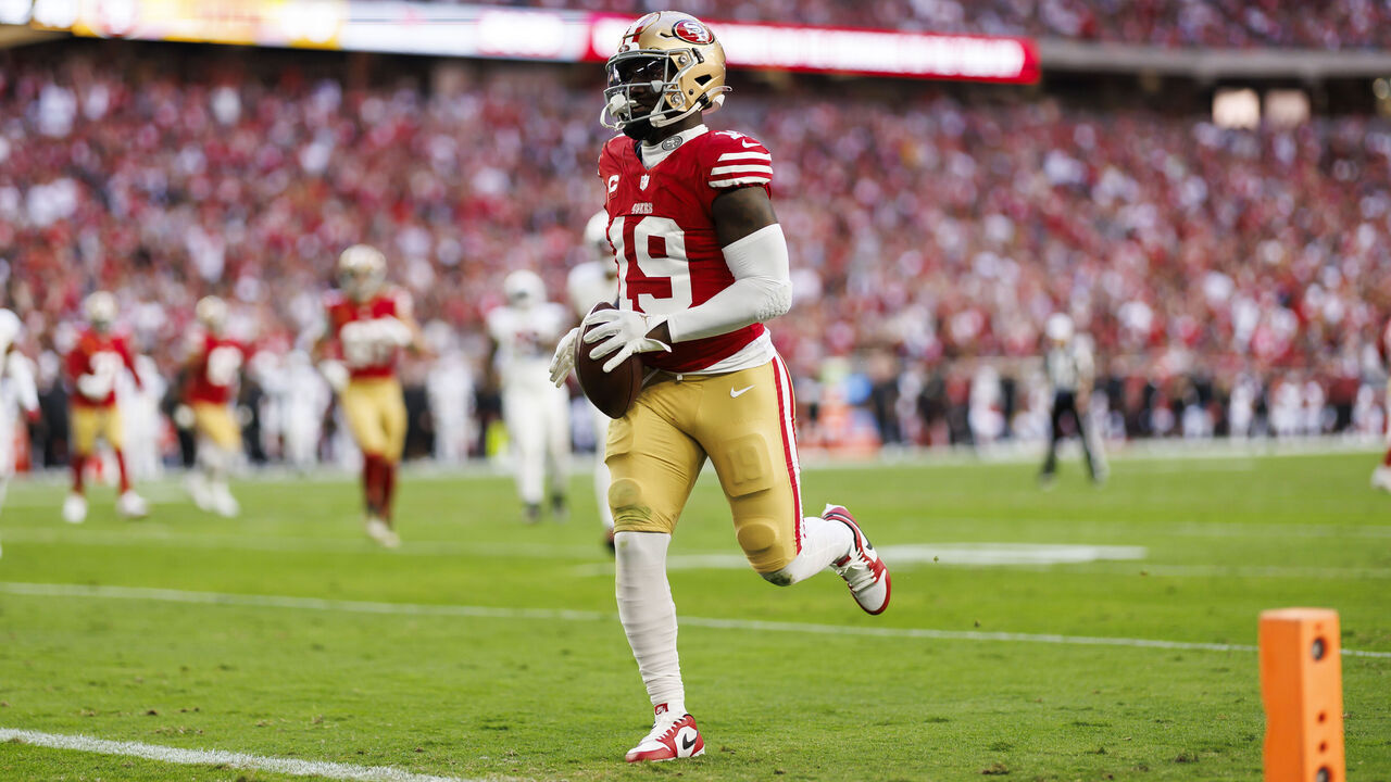 GLENDALE, ARIZONA - DECEMBER 17: Deebo Samuel #19 of the San Francisco 49ers runs the ball after a catch to score a touchdown during an NFL football game against the Arizona Cardinals at State Farm Stadium on December 17, 2023 in Glendale, Arizona.