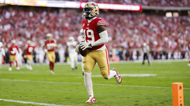 GLENDALE, ARIZONA - DECEMBER 17: Deebo Samuel #19 of the San Francisco 49ers runs the ball after a catch to score a touchdown during an NFL football game against the Arizona Cardinals at State Farm Stadium on December 17, 2023 in Glendale, Arizona.