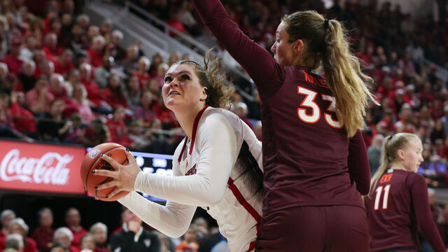 RALEIGH, NC - FEBRUARY 08: NC State Wolfpack center River Baldwin (1) looks to the basket as Virginia Tech Hokies center Elizabeth Kitley (33) defends during the college basketball game between the NC State Wolfpack and the Virginia Tech Hokies on February 8, 2024 at Reynolds Coliseum in Raleigh, NC.