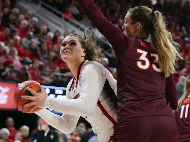 RALEIGH, NC - FEBRUARY 08: NC State Wolfpack center River Baldwin (1) looks to the basket as Virginia Tech Hokies center Elizabeth Kitley (33) defends during the college basketball game between the NC State Wolfpack and the Virginia Tech Hokies on February 8, 2024 at Reynolds Coliseum in Raleigh, NC.