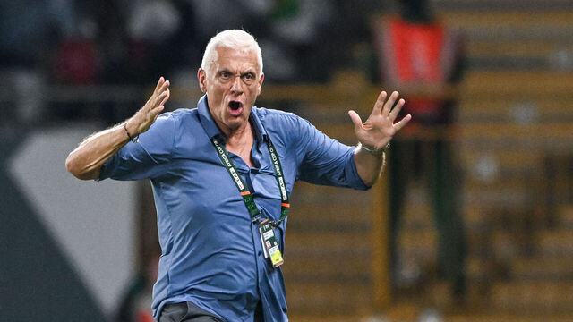 Burkina Faso's French coach Hubert Velud (L) reacts as he speaks with Congolese referee Jean-Jacques Ndala Ngambo (R) during the Africa Cup of Nations (CAN) 2024 group D football match between Angola and Burkina Faso at Stade Charles Konan Banny in Yamoussoukro on January 23, 2024.