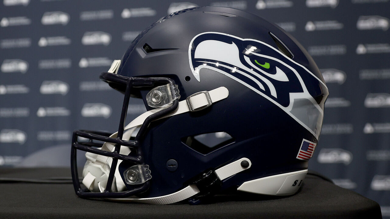 RENTON, WASHINGTON - FEBRUARY 01: A general view of the press conference stage, microphone, backdrop and Seattle Seahawks helmet after Mike Macdonald spoke to media after he was announced as the new Seattle Seahawks head coach at Virginia Mason Athletic Center on February 01, 2024 in Renton, Washington.