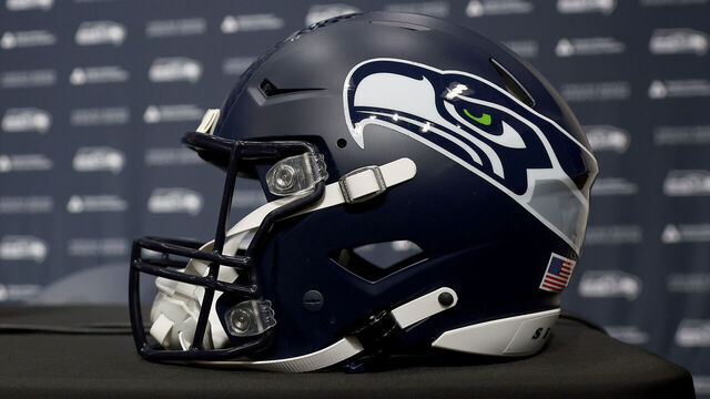 RENTON, WASHINGTON - FEBRUARY 01: A general view of the press conference stage, microphone, backdrop and Seattle Seahawks helmet after Mike Macdonald spoke to media after he was announced as the new Seattle Seahawks head coach at Virginia Mason Athletic Center on February 01, 2024 in Renton, Washington.