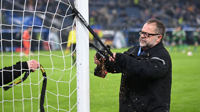 HAMBURG, GERMANY - FEBRUARY 09: Technicians remove bicycle locks that were attached to the soccer goal during the Second Bundesliga match between Hamburger SV and Hannover 96 at Volksparkstadion on February 09, 2024 in Hamburg, Germany.