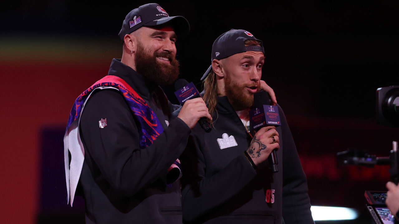 LAS VEGAS, NV - FEBRUARY 5: Travis Kelce #87 of the Kansas City Chiefs and George Kittle #85 of the San Francisco 49ers speaks with the media during Super Bowl LVIII Opening Night at Allegiant Stadium on February 5, 2024 in Las Vegas, NV.