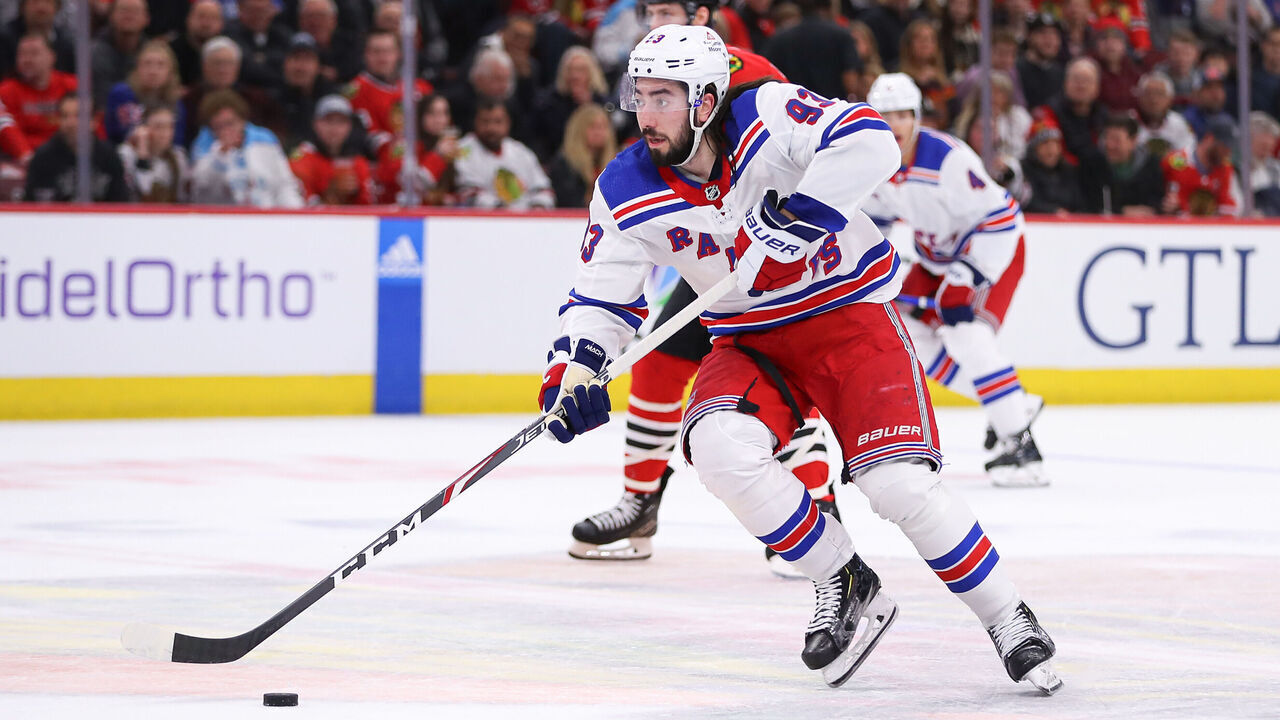 CHICAGO, IL - FEBRUARY 09: Mika Zibanejad #93 of the New York Rangers brings the puck up ice during the first period against the Chicago Blackhawks at the United Center on February 9, 2024 in Chicago, Illinois.