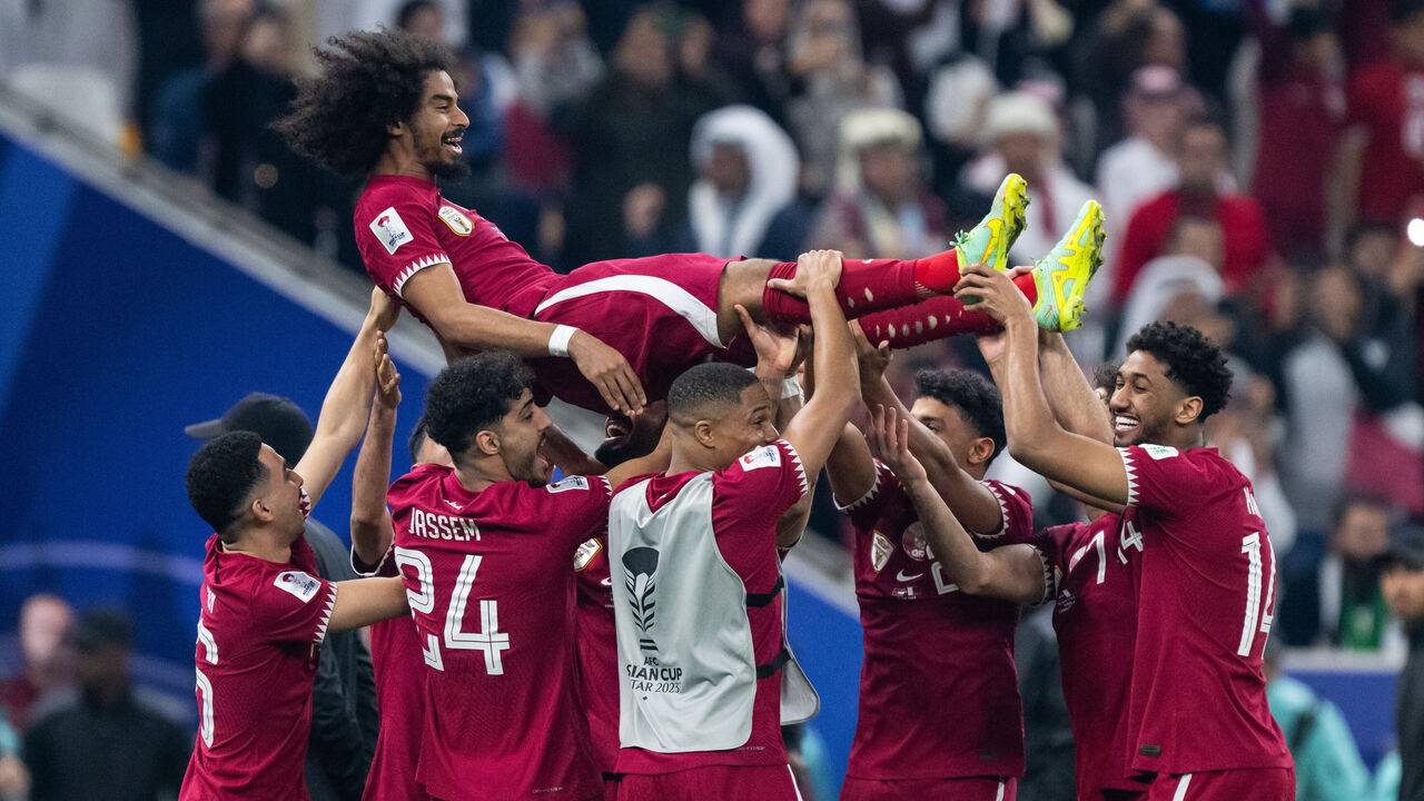 LUSAIL CITY, QATAR - FEBRUARY 10: Akram Afif of Qatar gets thrown in the air by his teammates after the AFC Asian Cup final match between Jordan and Qatar at Lusail Stadium on February 10, 2024 in Lusail City, Qatar.