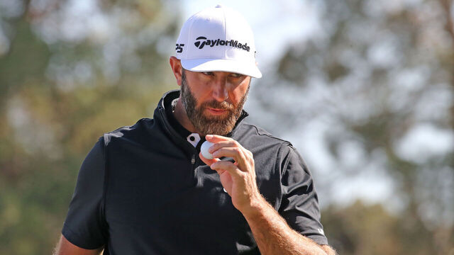 LAS VEGAS, NV - FEBRUARY 09: Dustin Johnson of 4Aces GC blows on his ball after marking it during the LIV Golf League tournament on February 09, 2024 at the Las Vegas Country Club in Las Vegas, NV.