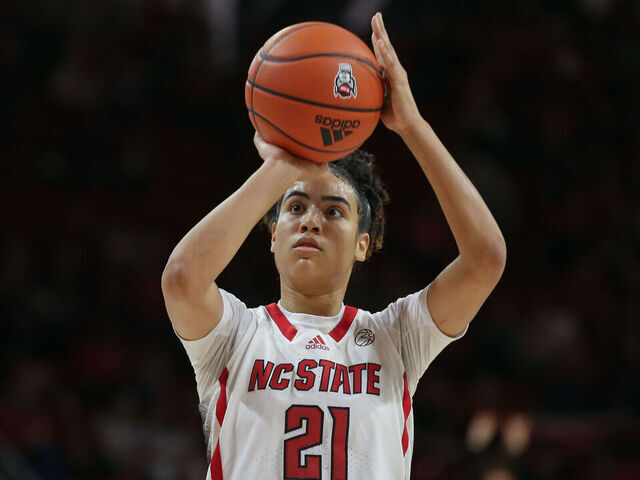 RALEIGH, NC - FEBRUARY 08: NC State Wolfpack guard Madison Hayes (21) shoots a free throw during the college basketball game between the NC State Wolfpack and the Virginia Tech Hokies on February 8, 2024 at Reynolds Coliseum in Raleigh, NC.