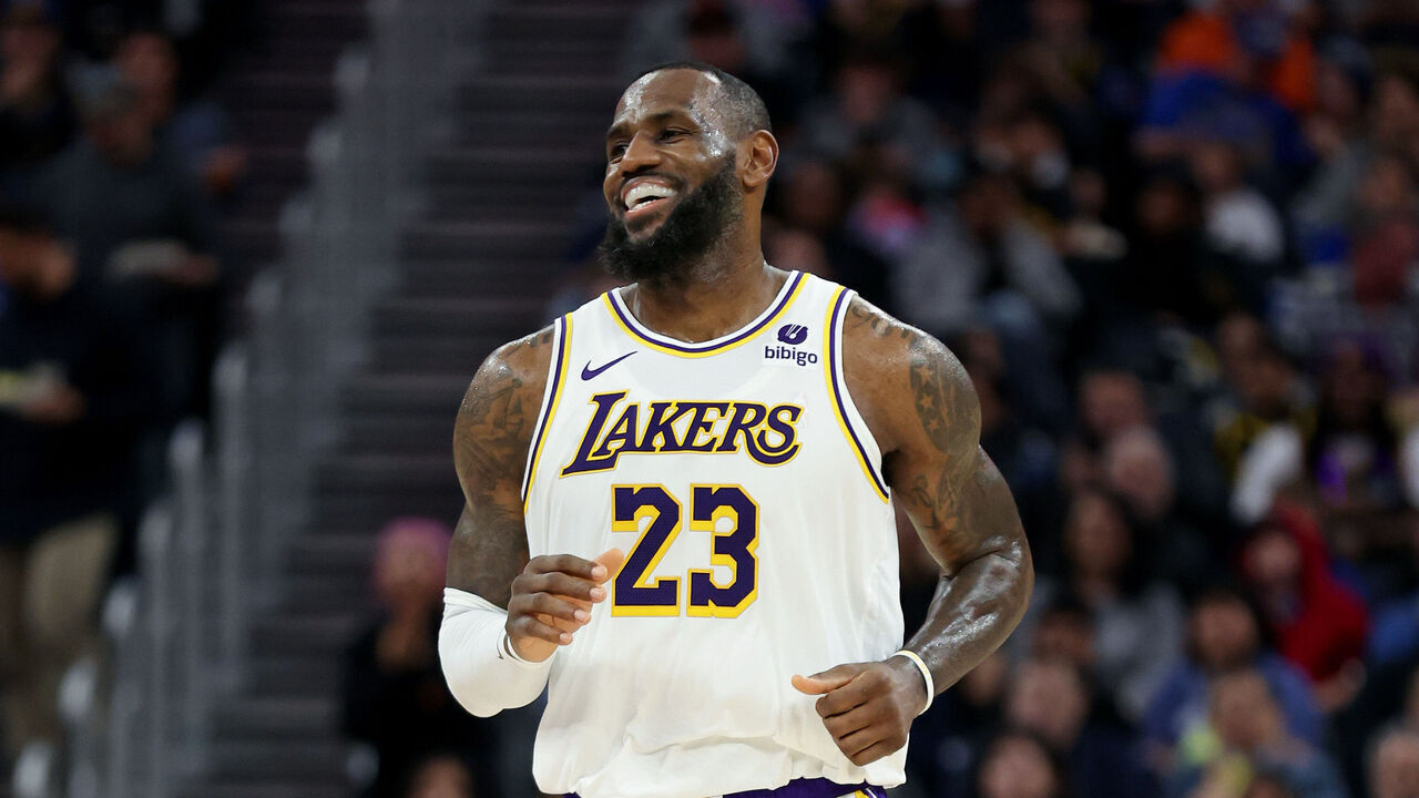 SAN FRANCISCO, CALIFORNIA - JANUARY 27: LeBron James #23 of the Los Angeles Lakers smiles as he runs down the court during their game against the Golden State Warriors at Chase Center on January 27, 2024 in San Francisco, California.