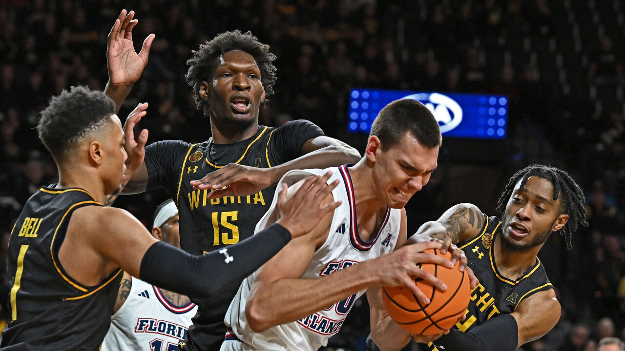 WICHITA, KS - FEBRUARY 11: Vladislav Goldin #50 of the Florida Atlantic Owls battles for the ball with Colby Rogers #4 of the Wichita State Shockers in the second half at Charles Koch Arena on February 11, 2024 in Wichita, Kansas.