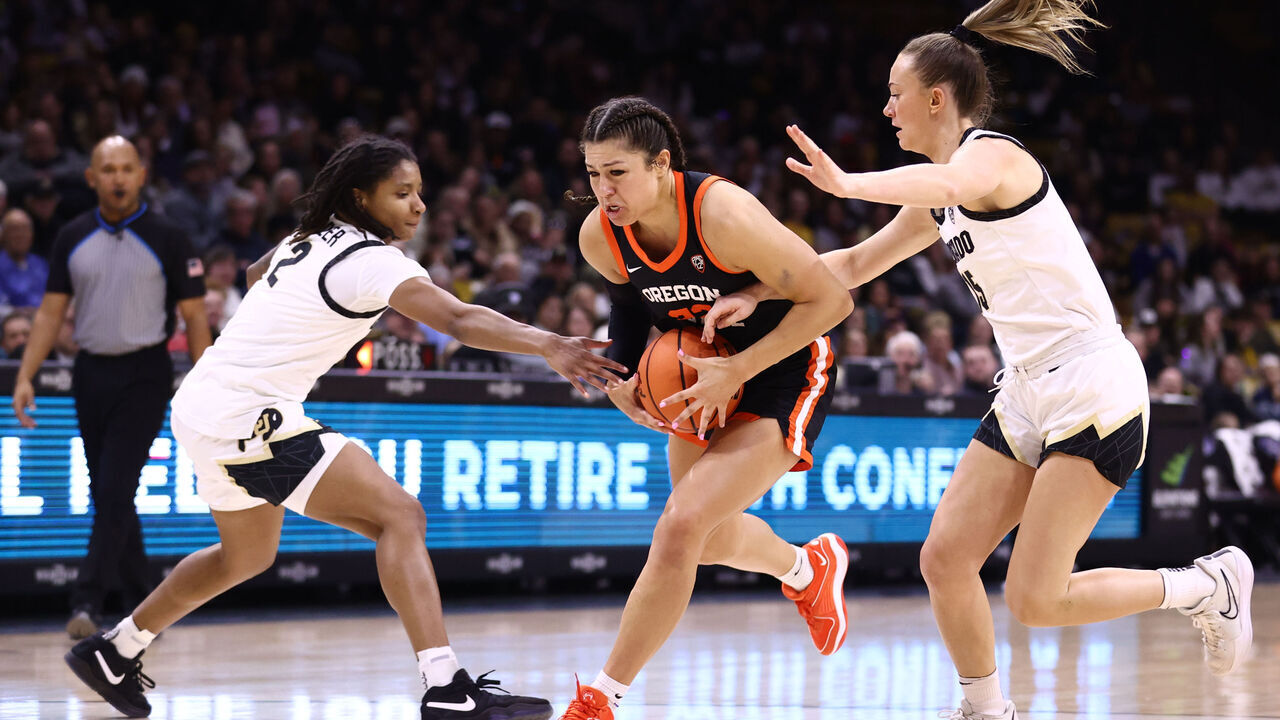 BOULDER, COLORADO - FEBRUARY 11: Tameiya Sadler #2 and Kindyll Wetta #15 of the Colorado Buffaloes pressure Talia von Oelhoffen #22 of the Oregon State Beavers in the first quarter at the CU Events Center on February 11, 2024 in Boulder, Colorado.