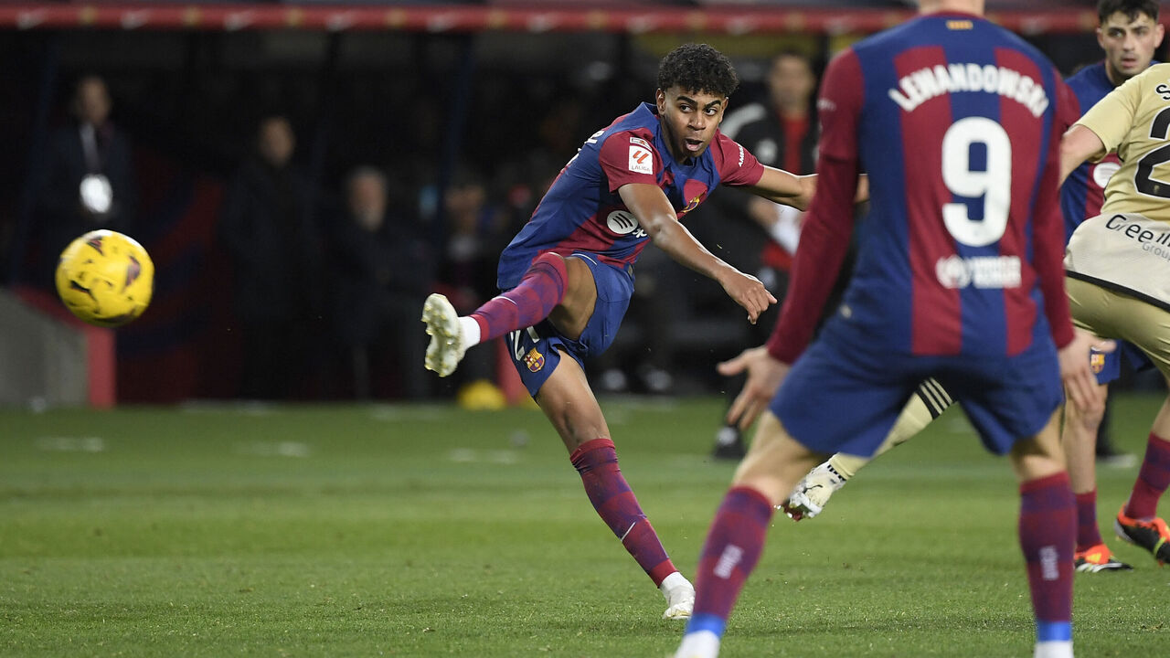 Barcelona's Spanish forward #27 Lamine Yamal scores his team's third goal during the Spanish league football match between FC Barcelona and Granada FC at the Estadi Olimpic Lluis Companys in Barcelona on February 11, 2024.
