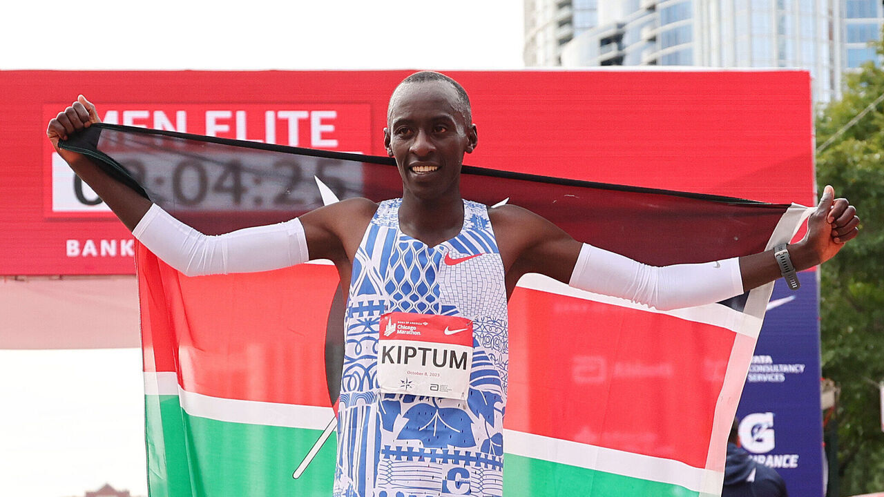 CHICAGO, ILLINOIS - OCTOBER 08: Kelvin Kiptum of Kenya celebrates after winning the 2023 Chicago Marathon professional men's division and setting a world record marathon time of 2:00.35 at Grant Park on October 08, 2023 in Chicago, Illinois.
