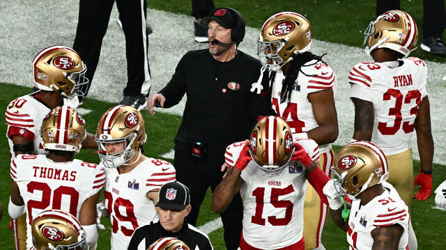 San Francisco 49ers' head coach Kyle Shanahan speaks with his players during Super Bowl LVIII between the Kansas City Chiefs and the San Francisco 49ers at Allegiant Stadium in Las Vegas, Nevada, February 11, 2024.