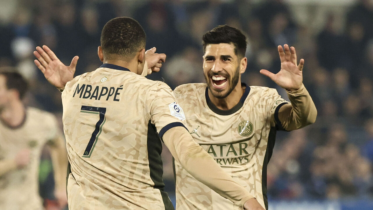 STRASBOURG, FRANCE - FEBRUARY 2: Marco Asensio #11 of Paris Saint-Germain celebrates his goal with Kylian Mbappe #7 of Paris Saint-Germain during the Ligue 1 Uber Eats match between RC Strasbourg and Paris Saint-Germain at Stade de la Meinau on February 2, 2024 in Strasbourg, France.