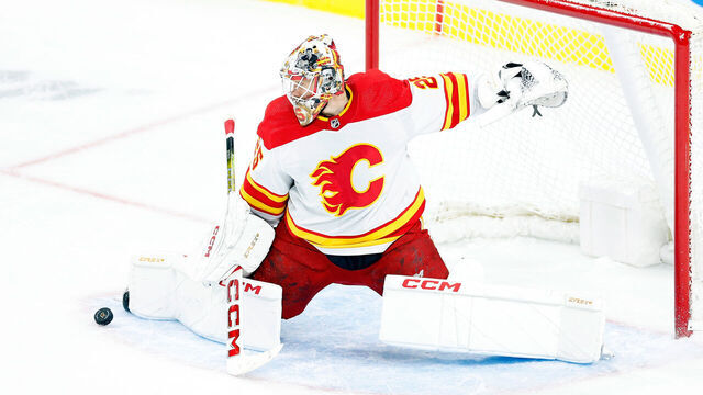 ST PAUL, MINNESOTA - JANUARY 02: Jacob Markstrom #25 of the Calgary Flames makes a save against the Minnesota Wild in the third period at Xcel Energy Center on January 02, 2024 in St Paul, Minnesota. The Flames defeated the Wild 3-1.