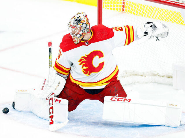 ST PAUL, MINNESOTA - JANUARY 02: Jacob Markstrom #25 of the Calgary Flames makes a save against the Minnesota Wild in the third period at Xcel Energy Center on January 02, 2024 in St Paul, Minnesota. The Flames defeated the Wild 3-1.