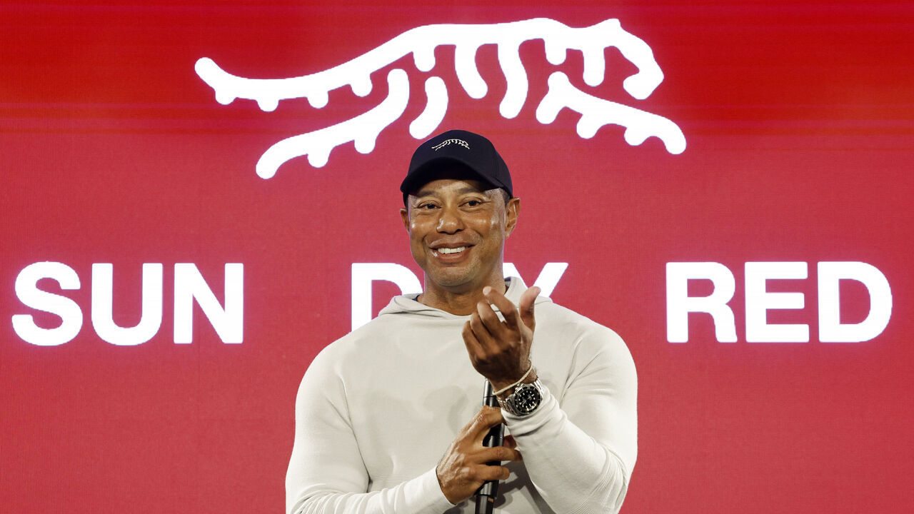 PACIFIC PALISADES, CALIFORNIA - FEBRUARY 12: Tiger Woods speaks during the launch of Tiger Woods and TaylorMade Golf's new apparel and footwear brand "Sun Day Red" at Palisades Village on February 12, 2024 in Pacific Palisades, California.