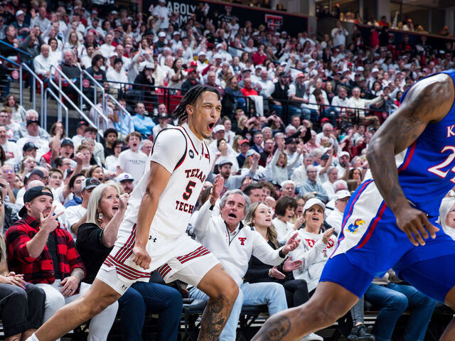 LUBBOCK, TEXAS - FEBRUARY 12: Darrion Williams #5 of the Texas Tech Red Raiders shouts after making a three-pointer during the first half of the game against the Kansas Jayhawks at United Supermarkets Arena on February 12, 2024 in Lubbock, Texas.