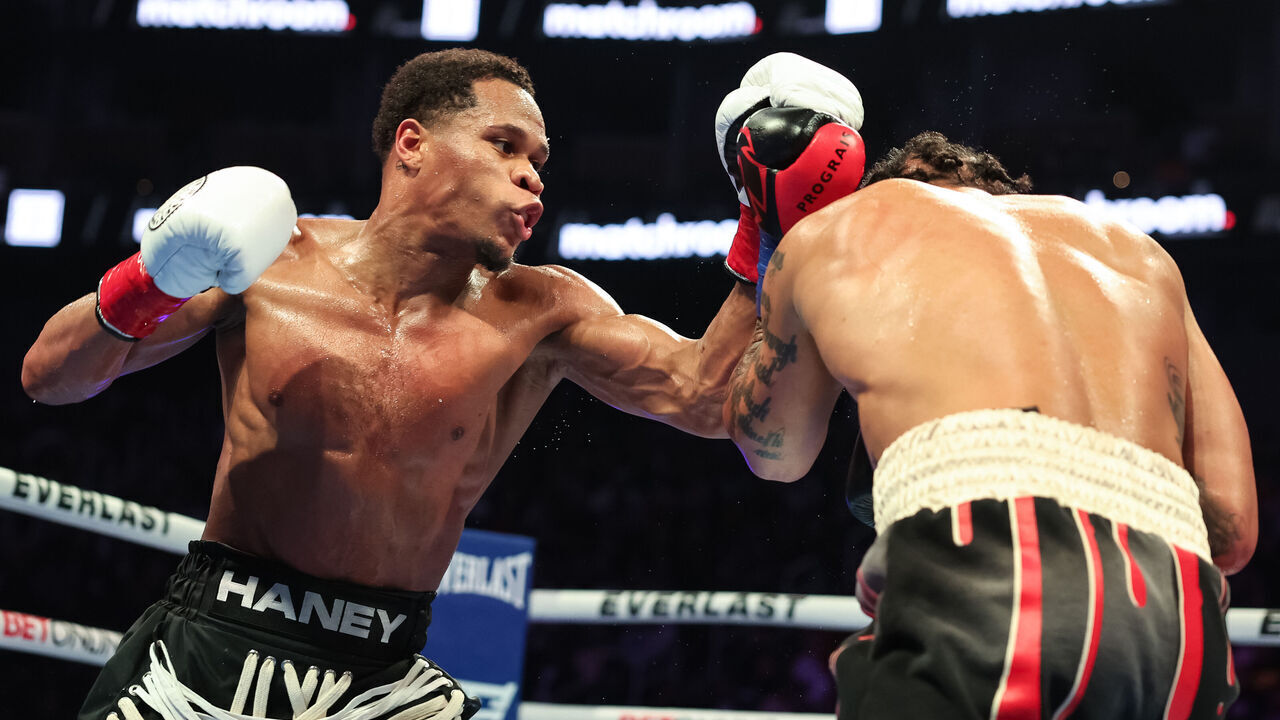 SAN FRANCISCO, CALIFORNIA - DECEMBER 09: Devin Haney punches Regis Prograis during their WBC World Super Lightweight Title fight at Chase Center on December 09, 2023 in San Francisco, California.