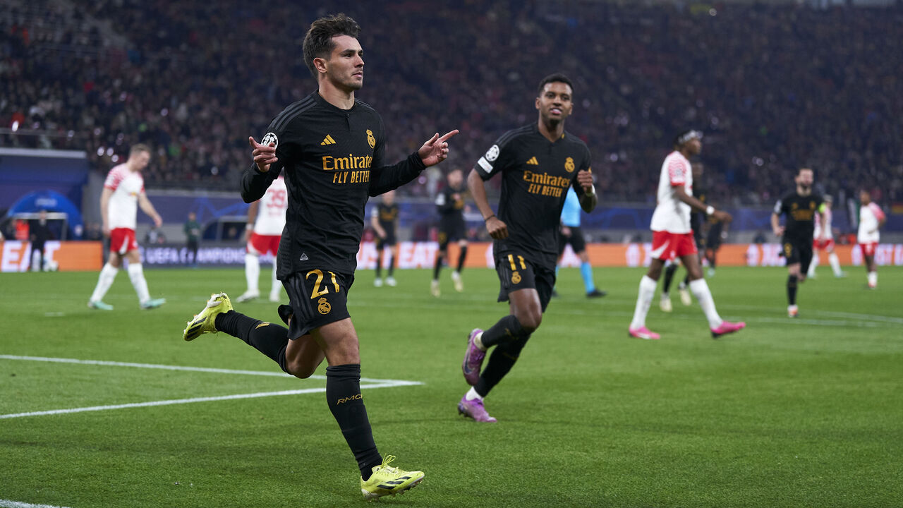 LEIPZIG, GERMANY - FEBRUARY 13: Brahim Diaz of Real Madrid CF celebrates after scoring his team's first goal during the UEFA Champions League 2023/24 round of 16 first leg match between RB Leipzig and Real Madrid CF at Red Bull Arena on February 13, 2024 in Leipzig, Germany.