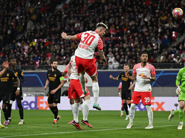 13 February 2024, Saxony, Leipzig: Soccer, Champions League, RB Leipzig - Real Madrid, knockout round, round of 16, first leg, at the Red Bull Arena. Leipzig's Benjamin Sesko (M) scores a goal which is disallowed for offside. Photo: Robert Michael/dpa