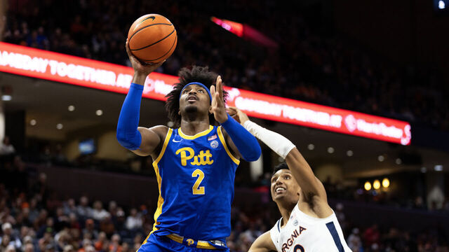 CHARLOTTESVILLE, VIRGINIA - FEBRUARY 13: Blake Hinson #2 of the Pittsburgh Panthers puts up a shot ahead of Ryan Dunn #13 of the Virginia Cavaliers in the first half at John Paul Jones Arena on February 13, 2024 in Charlottesville, Virginia.