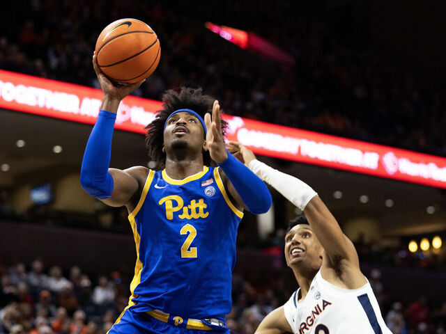 CHARLOTTESVILLE, VIRGINIA - FEBRUARY 13: Blake Hinson #2 of the Pittsburgh Panthers puts up a shot ahead of Ryan Dunn #13 of the Virginia Cavaliers in the first half at John Paul Jones Arena on February 13, 2024 in Charlottesville, Virginia.
