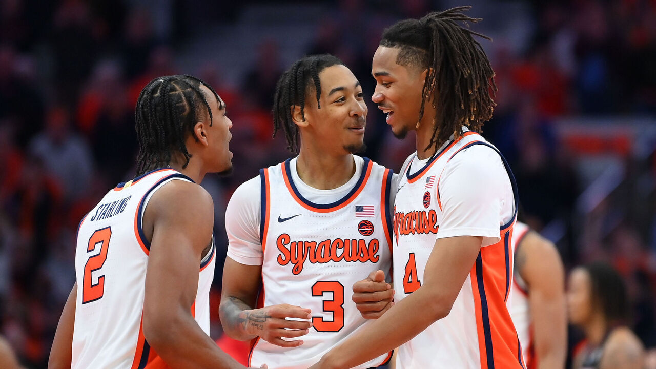 SYRACUSE, NEW YORK - FEBRUARY 7: JJ Starling #2, Judah Mintz #3 and Chris Bell #4 of the Syracuse Orange react to a play against the Louisville Cardinals during the second half at the JMA Wireless Dome on February 7, 2024 in Syracuse, New York. Syracuse won 94-92.