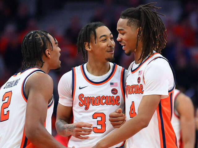 SYRACUSE, NEW YORK - FEBRUARY 7: JJ Starling #2, Judah Mintz #3 and Chris Bell #4 of the Syracuse Orange react to a play against the Louisville Cardinals during the second half at the JMA Wireless Dome on February 7, 2024 in Syracuse, New York. Syracuse won 94-92.