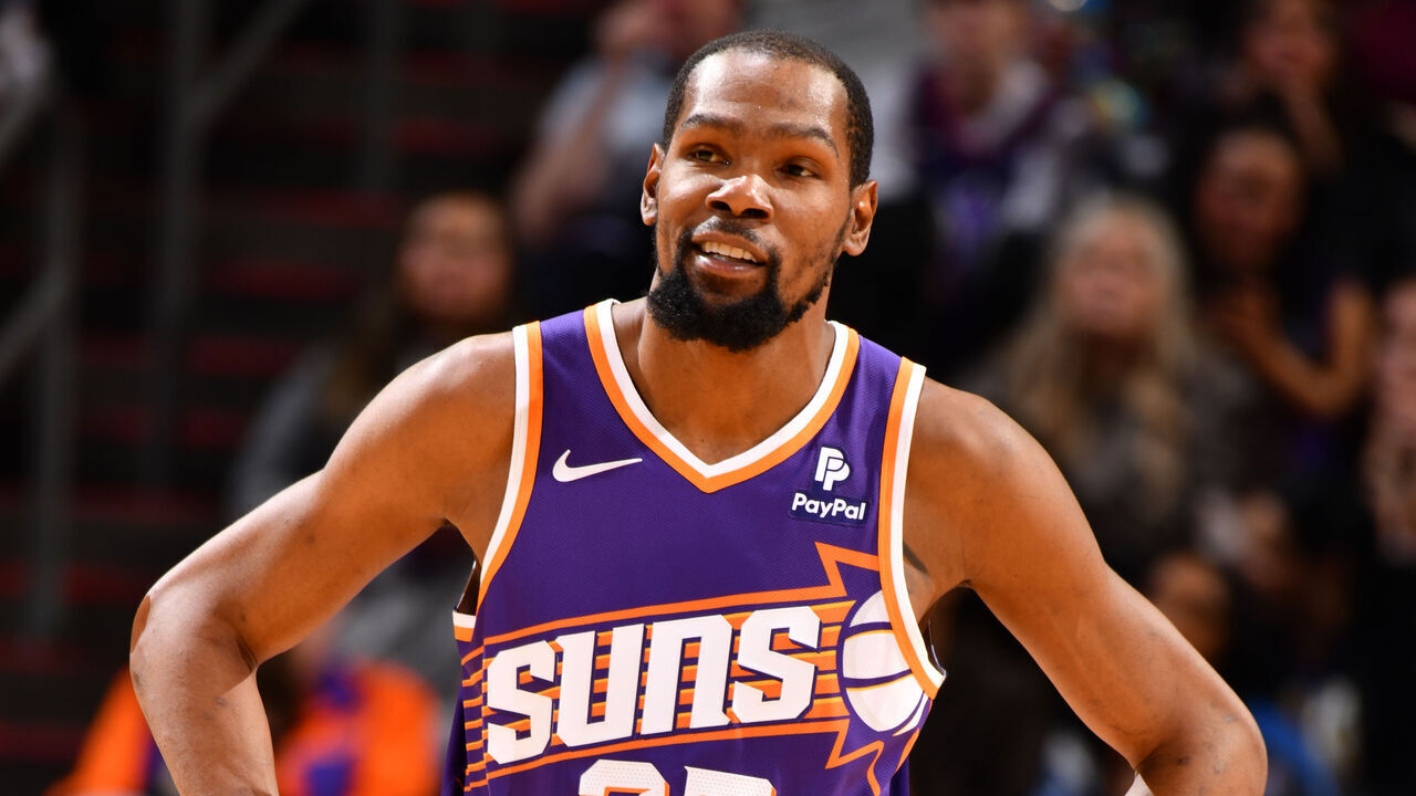 PHOENIX, AZ - FEBRUARY 13: Kevin Durant #35 of the Phoenix Suns smiles during the game against the Sacramento Kings on February 13, 2024 at Footprint Center in Phoenix, Arizona. Mandatory Copyright Notice: Copyright 2024 NBAE