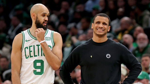 Boston, MA - January 10: Derrick White #9 of the Boston Celtics looks over at head coach Joe Mazzulla during the second half at the Garden.