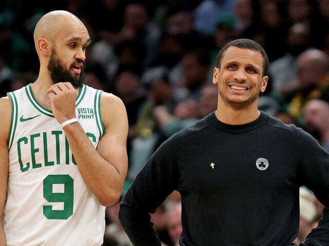 Boston, MA - January 10: Derrick White #9 of the Boston Celtics looks over at head coach Joe Mazzulla during the second half at the Garden.