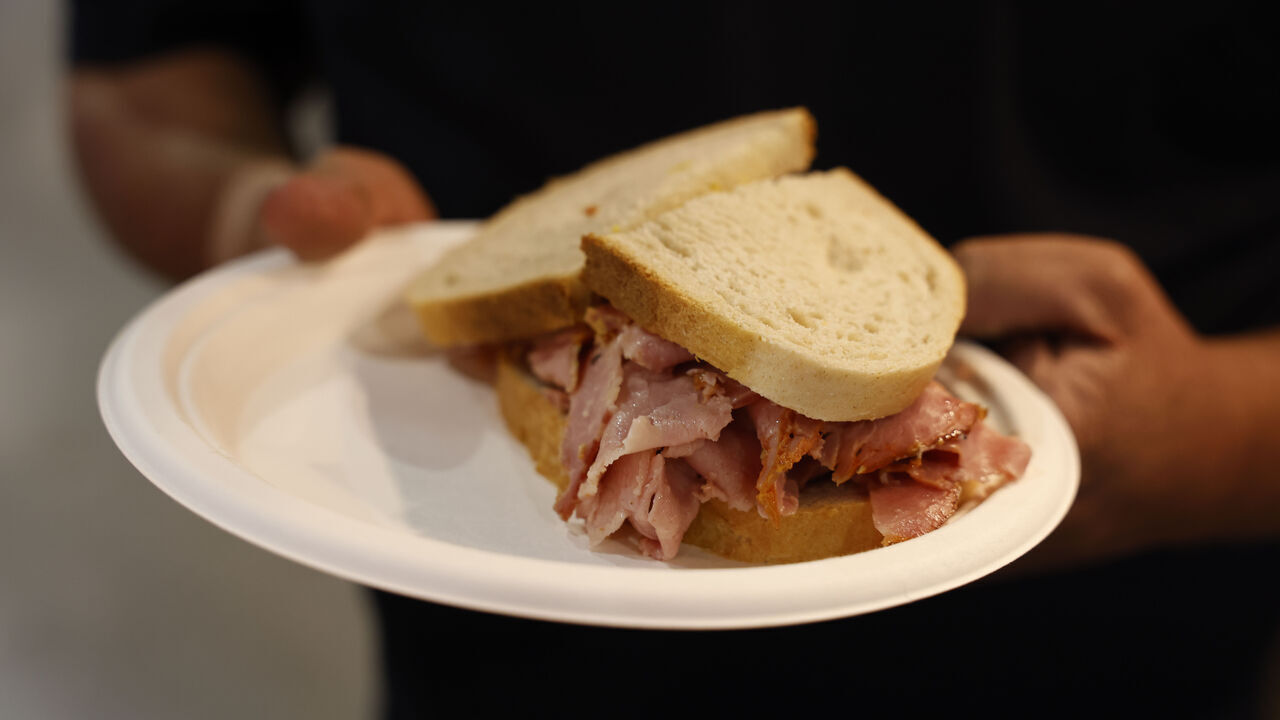 TORONTO, ON - August 18 - Mike Knott, Manager, Midway Concessions & Outdoor Exhibits, holds up a sandwich, just one of the many food options available at the CNE in Toronto. Lance McMillan/Toronto Star August-18-2023 (Lance McMillan/Toronto Star via Getty Images)
