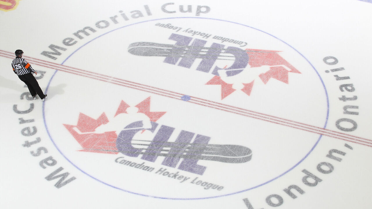 LONDON, ON - MAY 17: Referee Sean Reid #26 skates over the centre ice logo prior to play between the Guelph Storm and the Edmonton Oil Kings in Game Two of the 2014 Mastercard Memorial Cup at Budweiser Gardens on May 17, 2014 in London, Ontario, Canada. The Storm defeated the Oil Kings 5-2.
