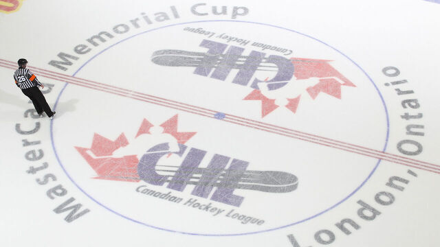 LONDON, ON - MAY 17: Referee Sean Reid #26 skates over the centre ice logo prior to play between the Guelph Storm and the Edmonton Oil Kings in Game Two of the 2014 Mastercard Memorial Cup at Budweiser Gardens on May 17, 2014 in London, Ontario, Canada. The Storm defeated the Oil Kings 5-2.