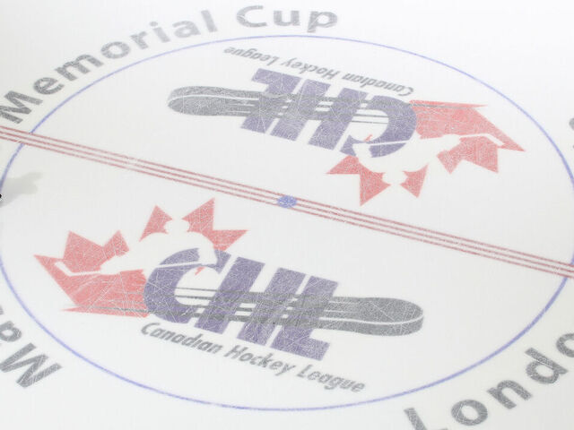 LONDON, ON - MAY 17: Referee Sean Reid #26 skates over the centre ice logo prior to play between the Guelph Storm and the Edmonton Oil Kings in Game Two of the 2014 Mastercard Memorial Cup at Budweiser Gardens on May 17, 2014 in London, Ontario, Canada. The Storm defeated the Oil Kings 5-2.