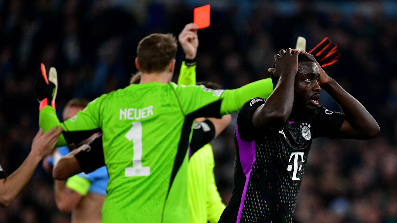 ROME, ITALY - FEBRUARY 14: The referee Francois Letexier show a ref cardo to Dayot Upamecano of Bayern Munchen during the UEFA Champions League 2023/24 round of 16 first leg match between SS Lazio and FC Bayern München at Stadio Olimpico on February 14, 2024 in Rome, Italy.