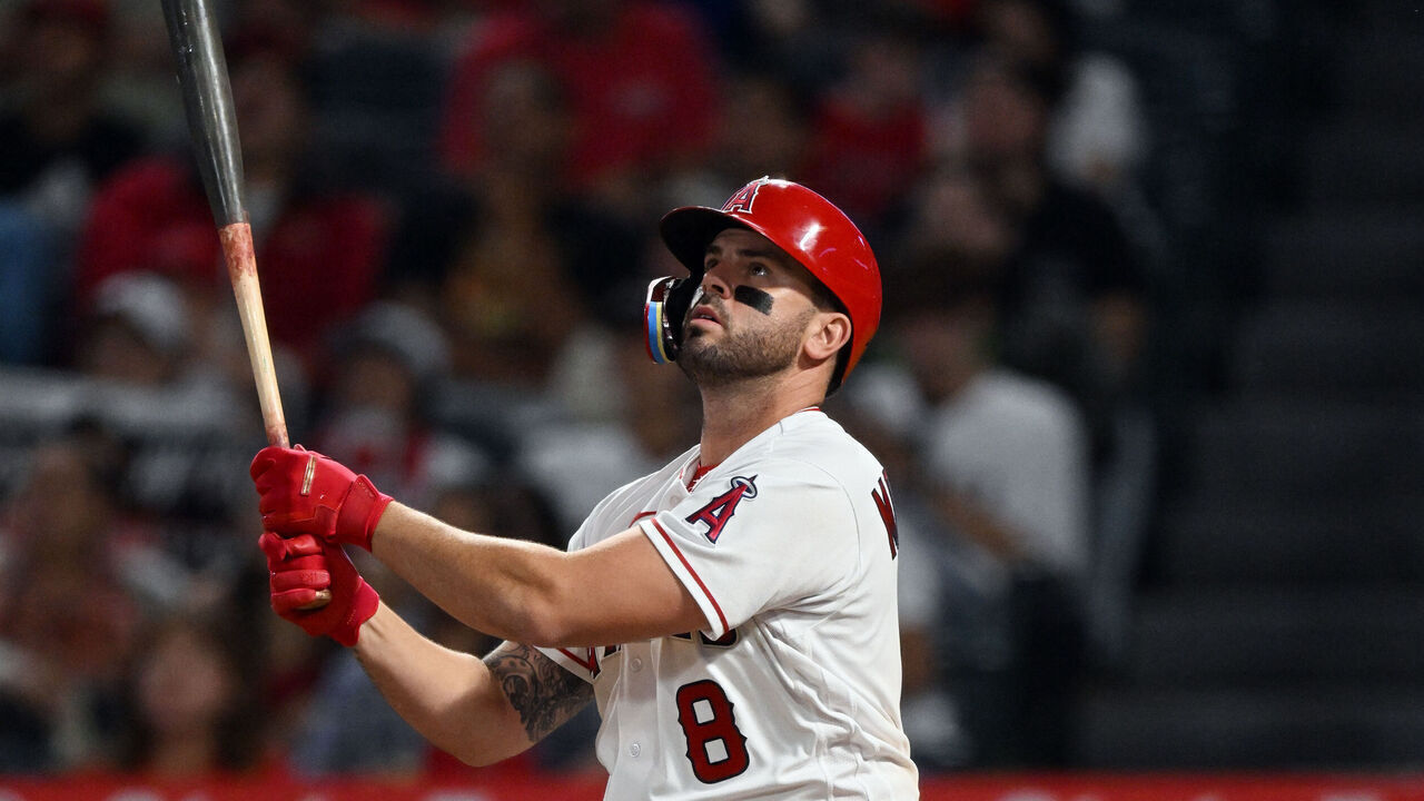 ANAHEIM, CA - SEPTEMBER 06: Los Angeles Angels third baseman Mike Moustakas (8) hits a sacrifice fly driving in a run during the sixth inning of an MLB baseball game against the Baltimore Orioles played on September 6, 2023 at Angel Stadium in Anaheim, CA.