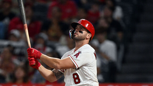 ANAHEIM, CA - SEPTEMBER 06: Los Angeles Angels third baseman Mike Moustakas (8) hits a sacrifice fly driving in a run during the sixth inning of an MLB baseball game against the Baltimore Orioles played on September 6, 2023 at Angel Stadium in Anaheim, CA.
