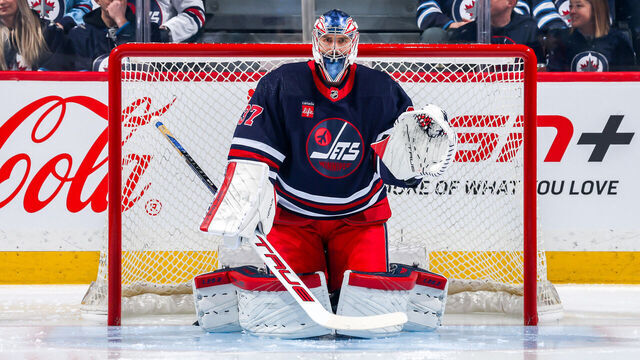 WINNIPEG, CANADA - FEBRUARY 14: Goaltender Connor Hellebuyck #37 of the Winnipeg Jets gets set in the crease prior to puck drop against the San Jose Sharks at the Canada Life Centre on February 14, 2024 in Winnipeg, Manitoba, Canada.